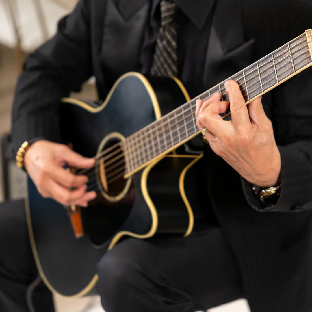 The guitar player performing at an elegant event
