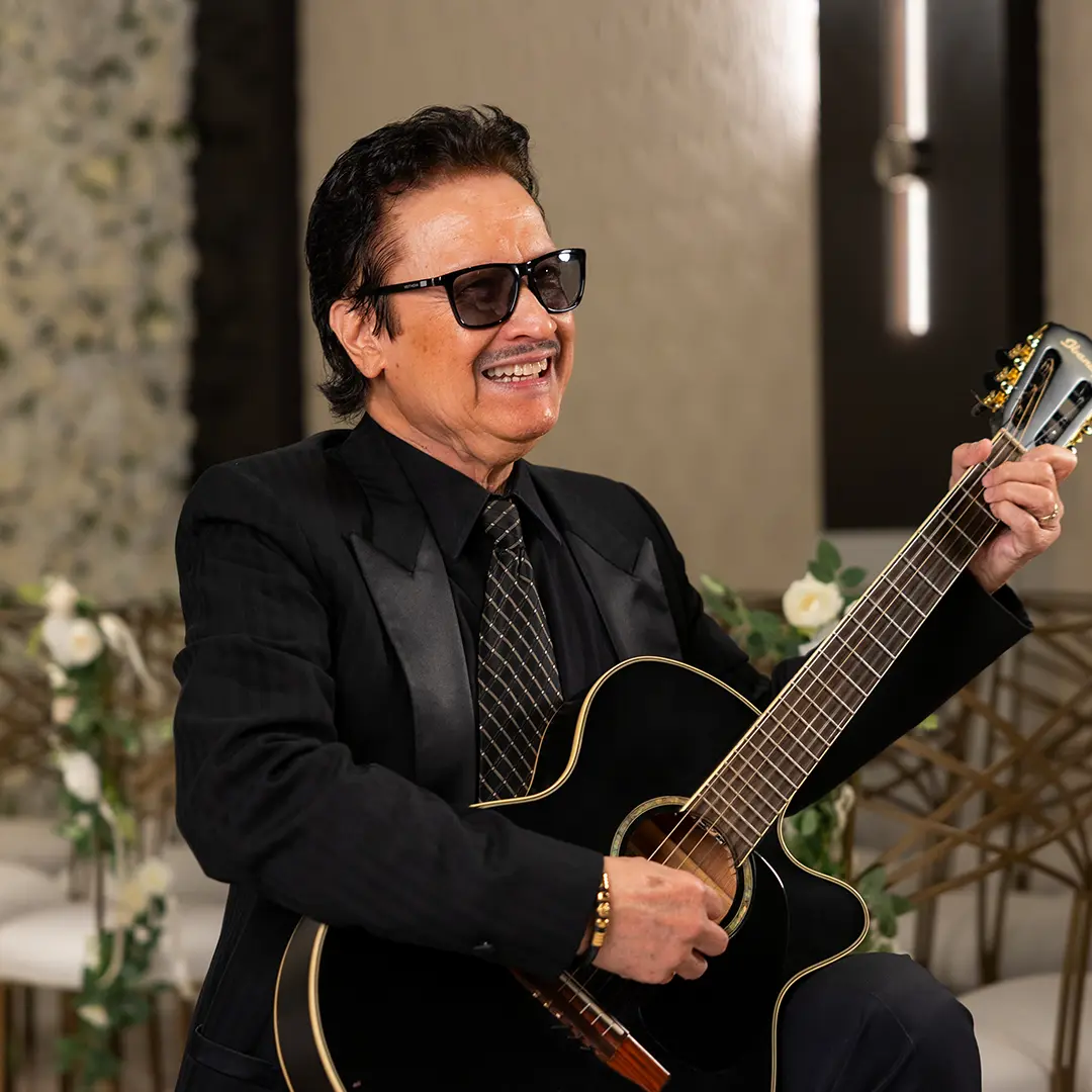 Danny Mac playing guitar