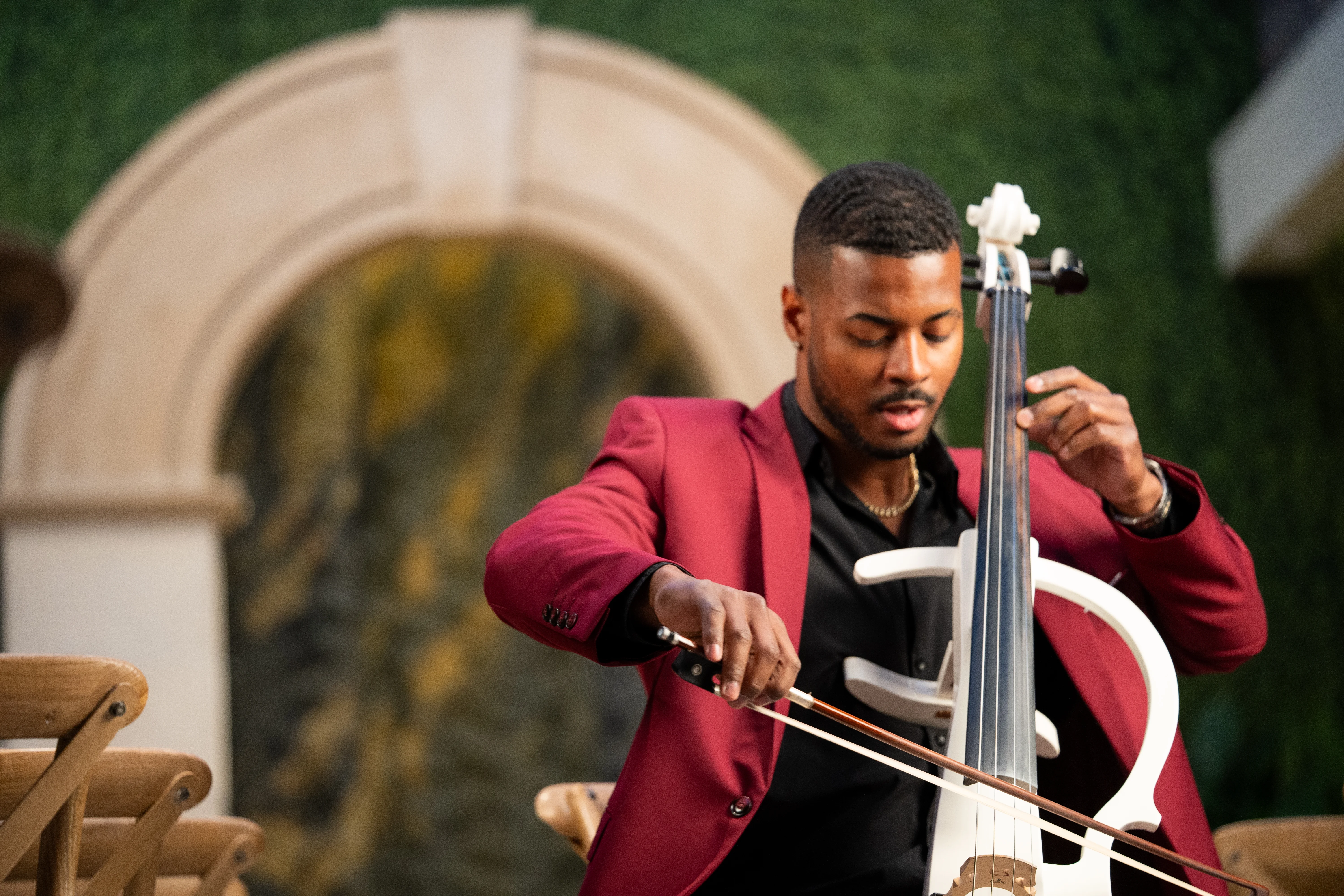 The Cello Guy performing beneath the chapel arch