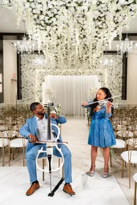Violinist and cellist playing together at an event