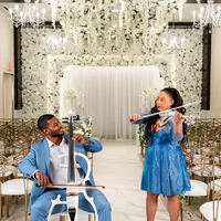 The duo performing in a grand hall