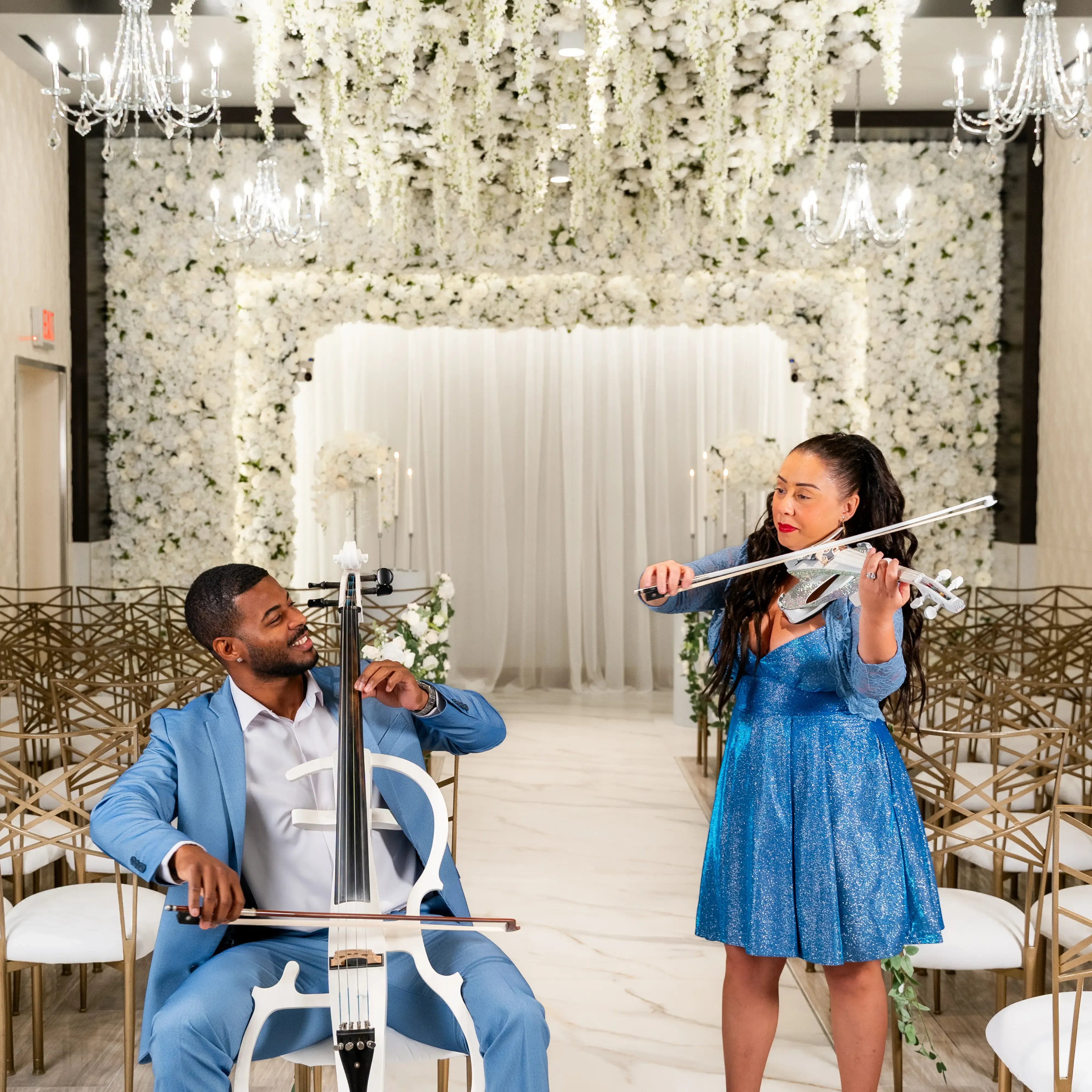 The duo performing in a grand hall