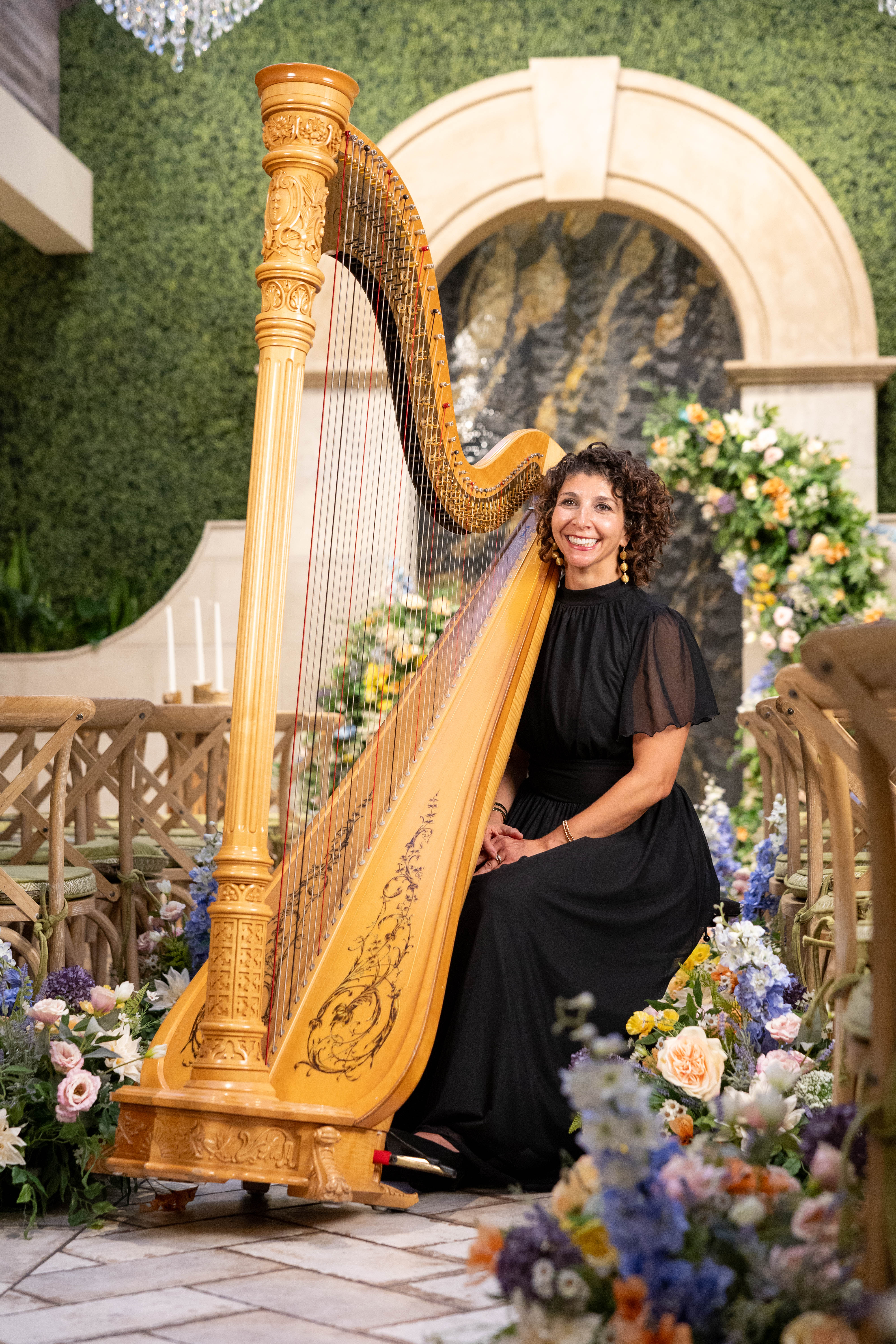 Close-up of the harpist's hands on the strings