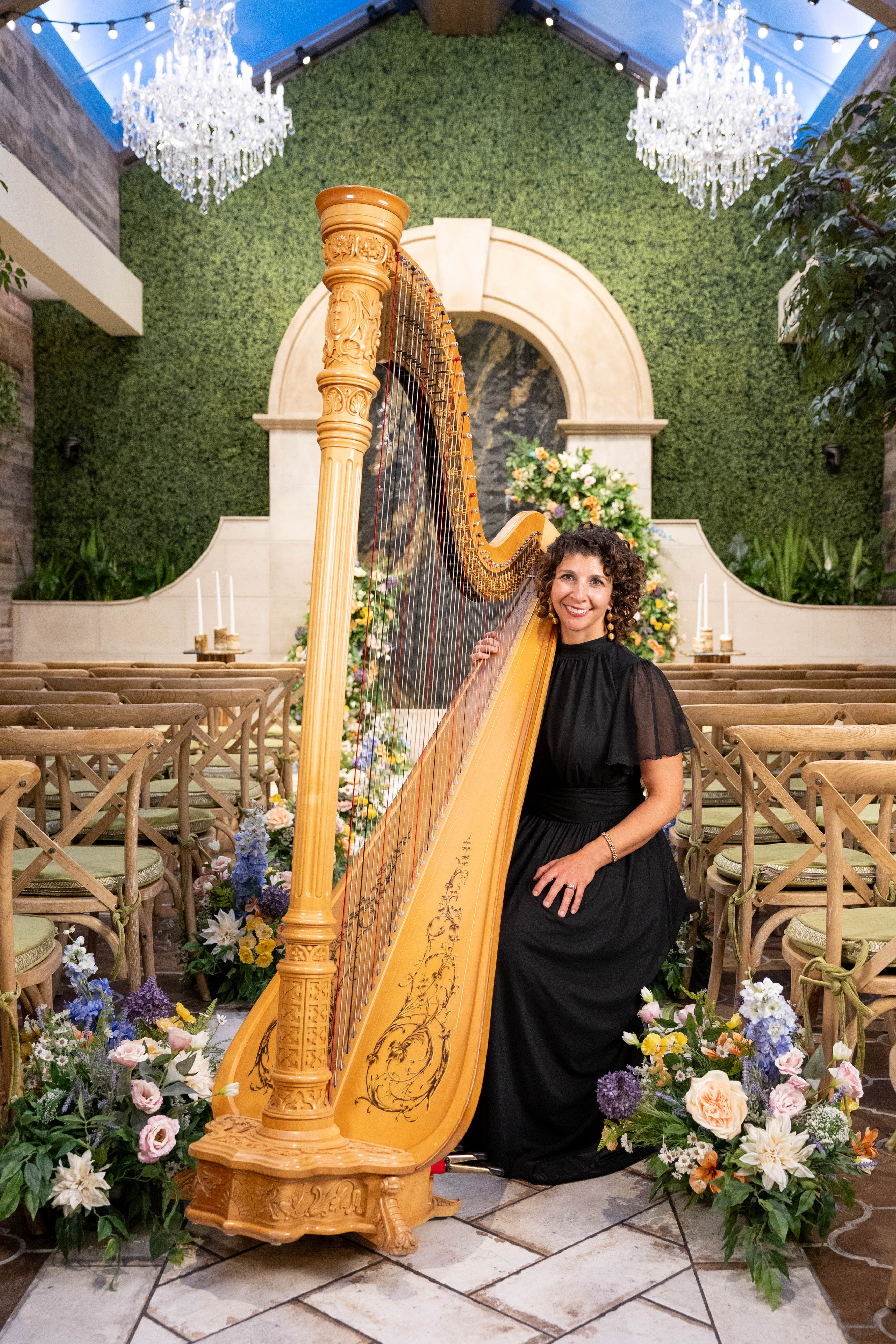 Harpist performing beside the ceremony setup