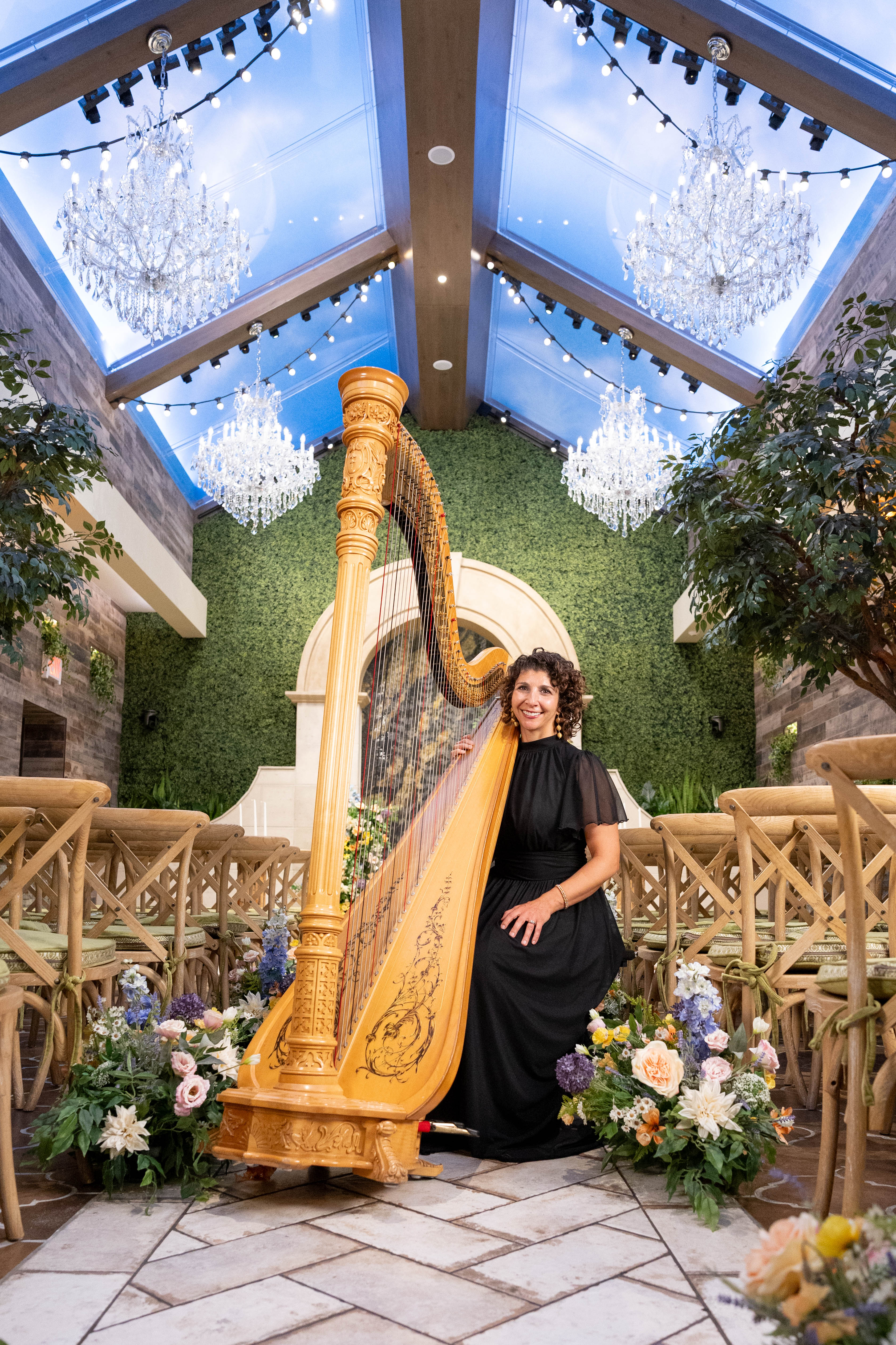 Harpist playing the harp for guests