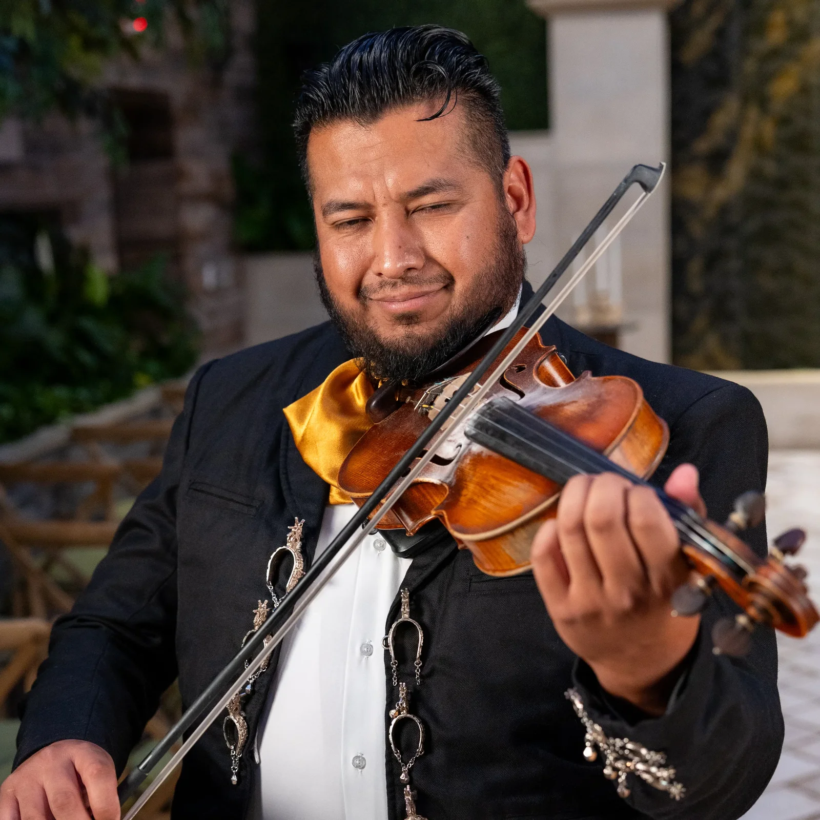 Mariachi trumpet and violin players